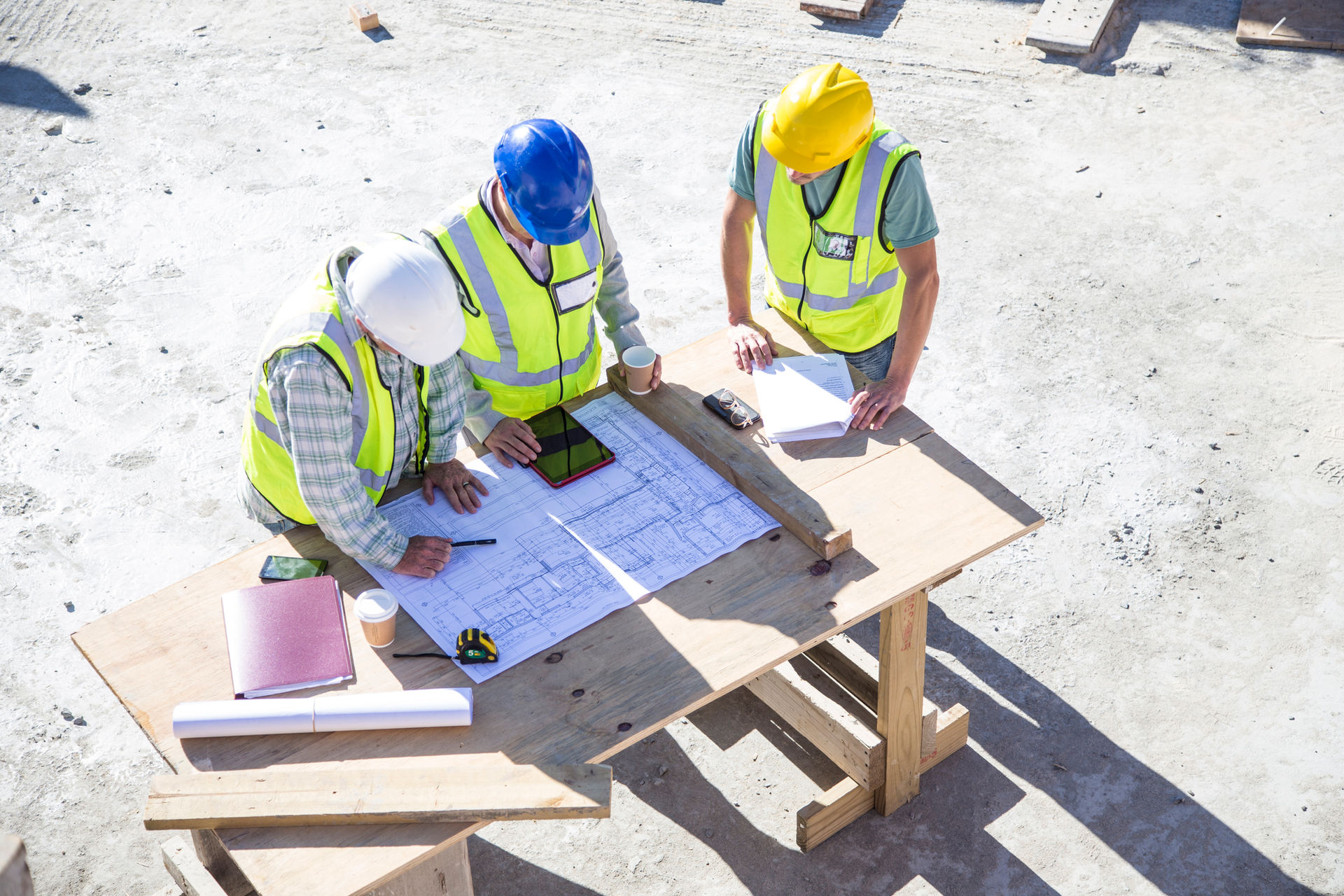 Industrial construction team reviewing plans